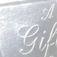 Bright silver, blind embossed, card